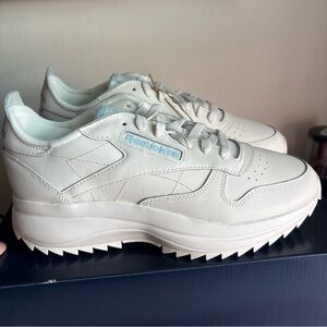 Reebok Cream Sneakers with Blue Accents